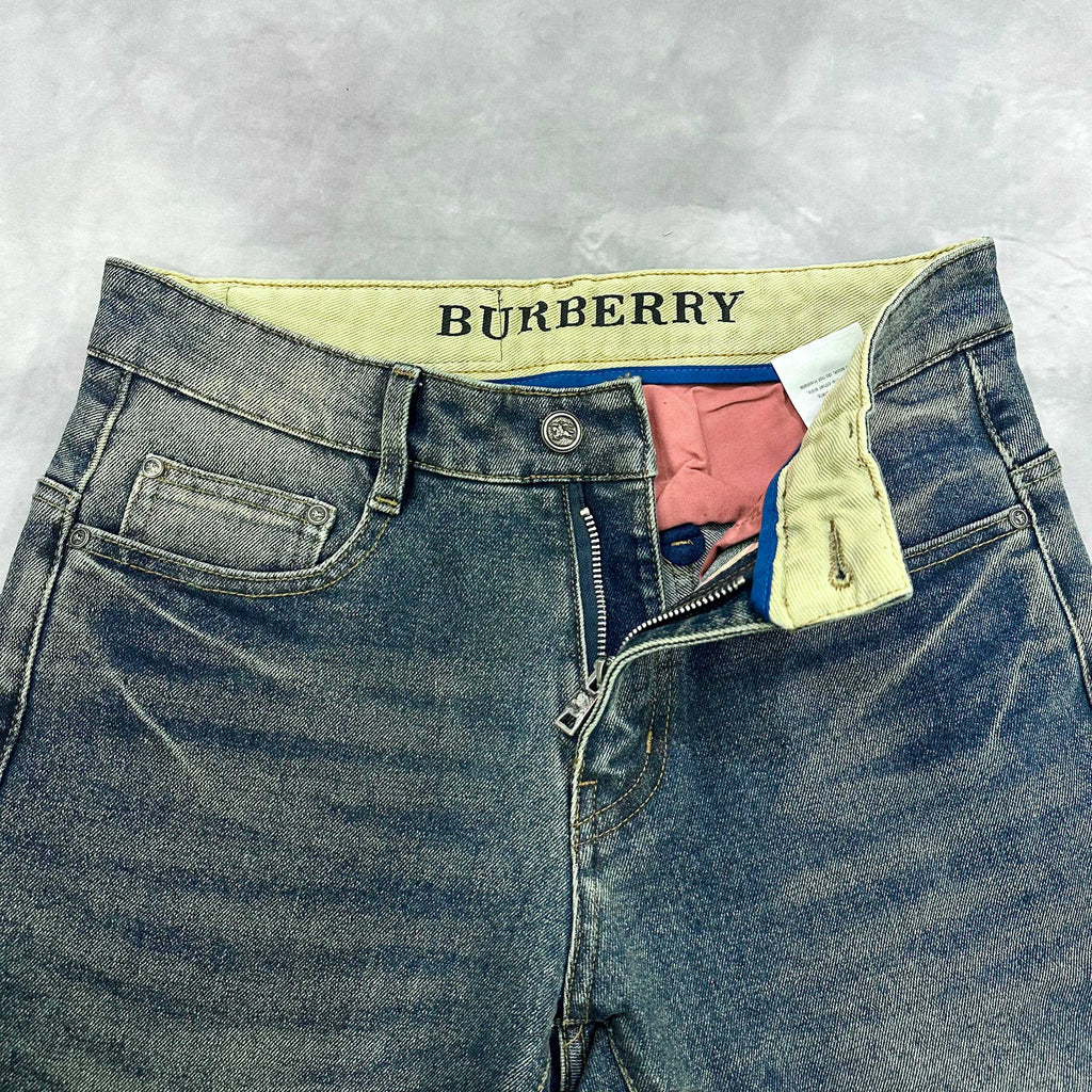 Burberry blue denim jeans top view with yellow contrast waistband and zipper fly