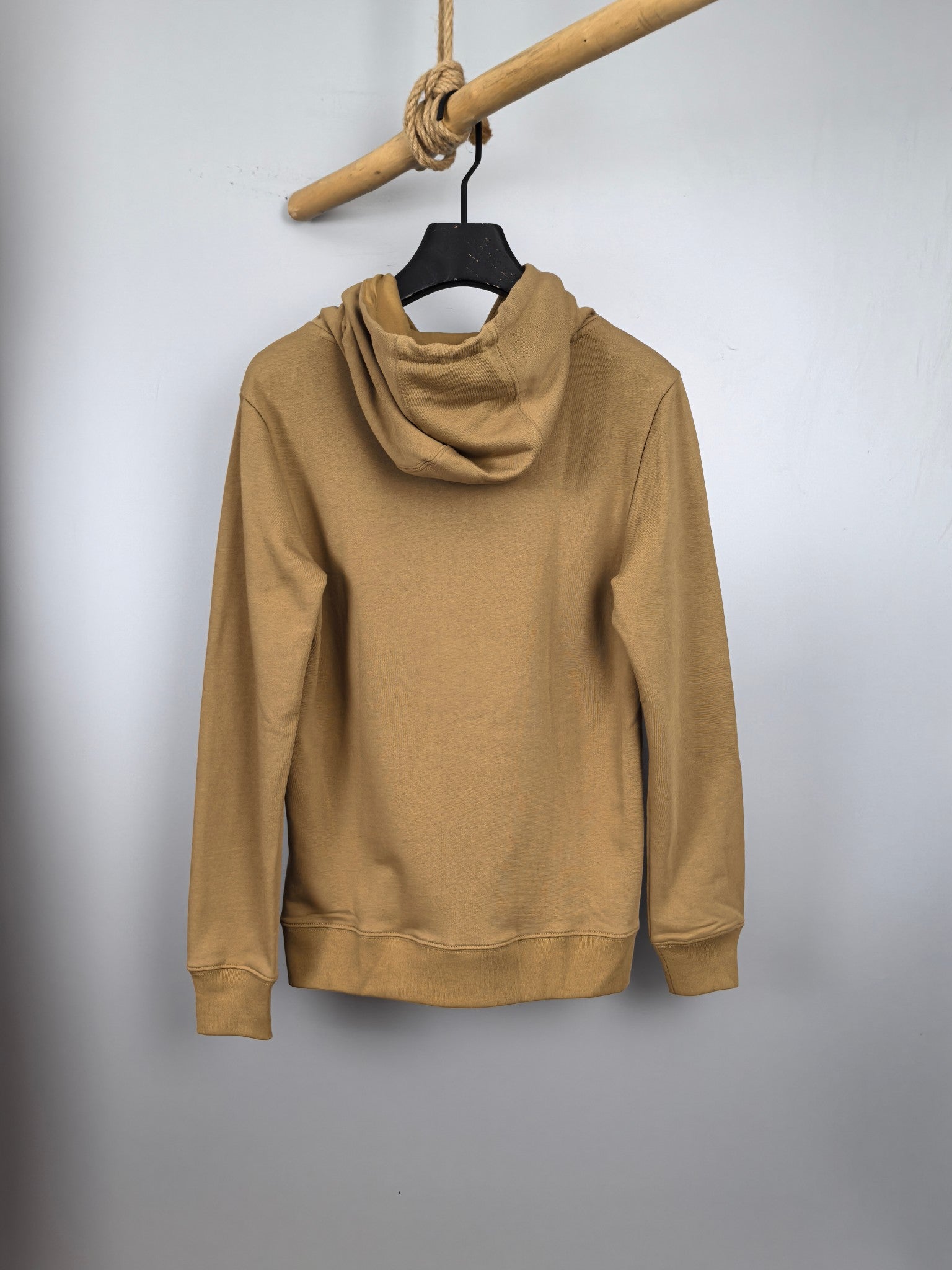 Tan zip-up hoodie with hood and drawstrings, back view