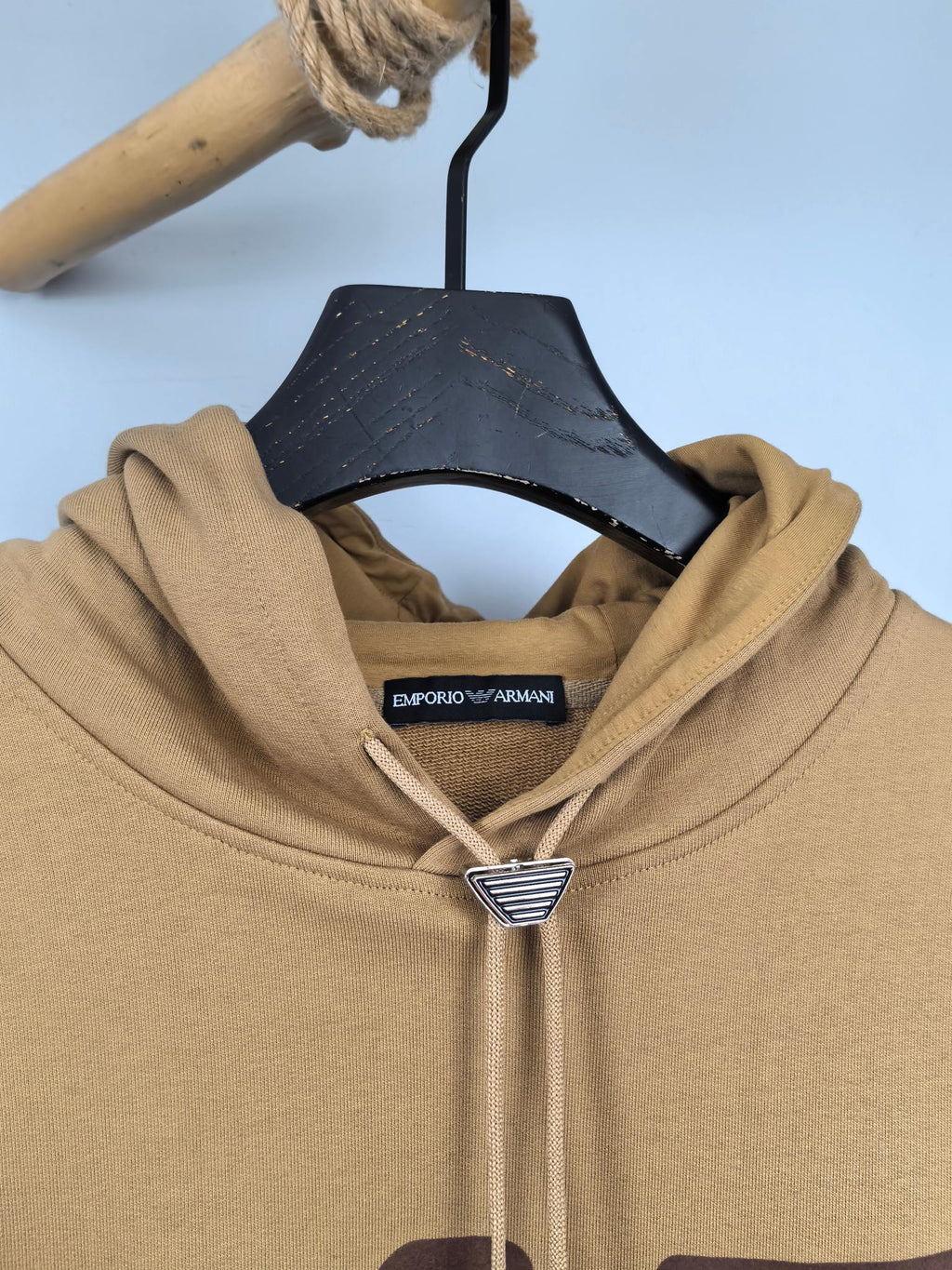 Tan hoodie collar with Emporio Armani neck label and metal logo detail