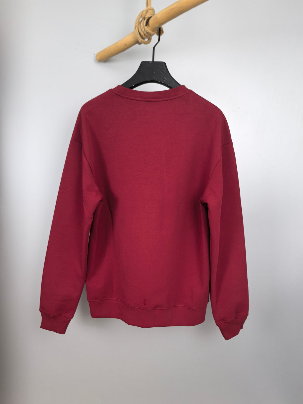 Red long-sleeve crewneck sweatshirt, back view