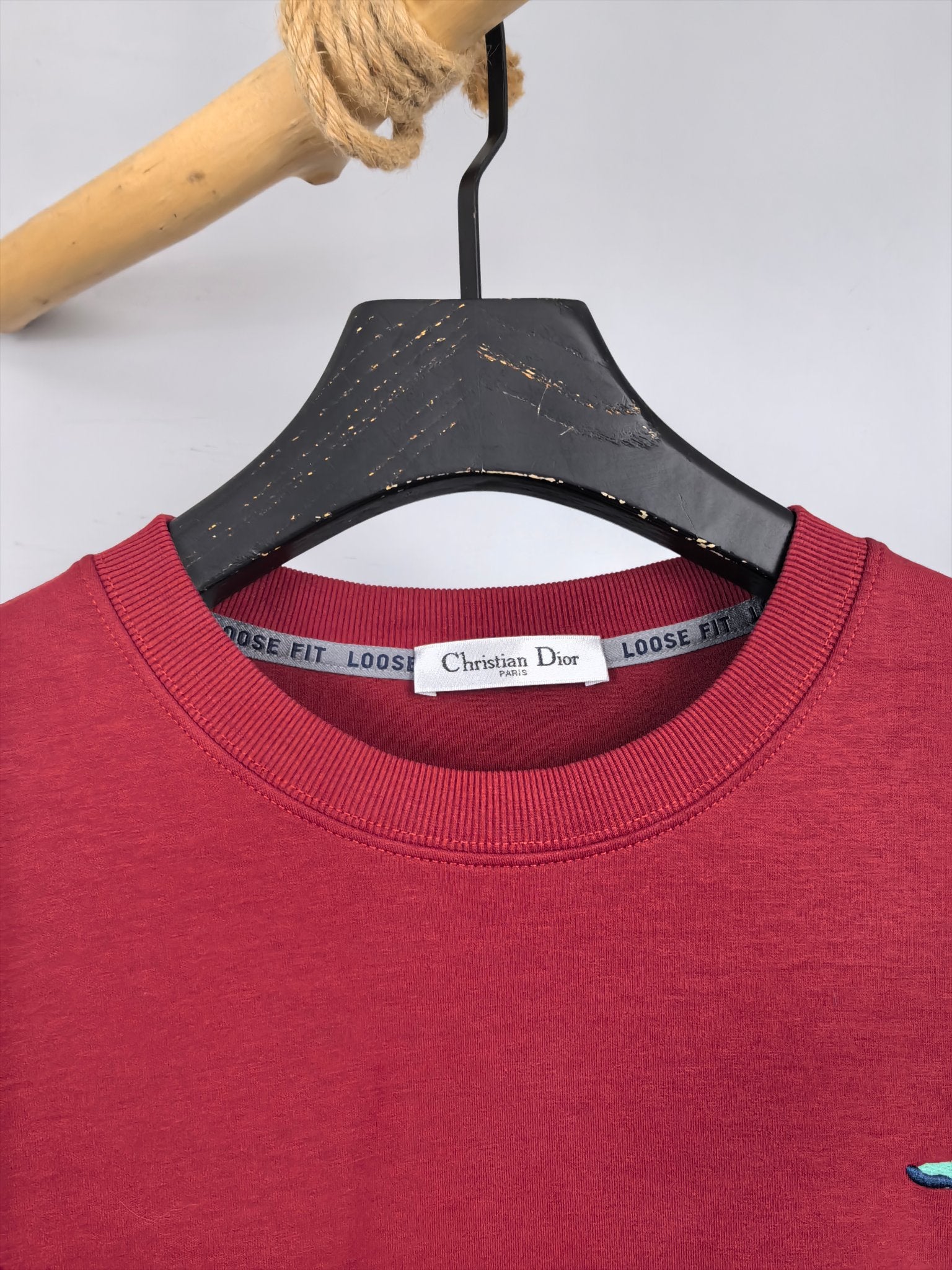 Red crewneck sweatshirt with Christian Dior neck label detail