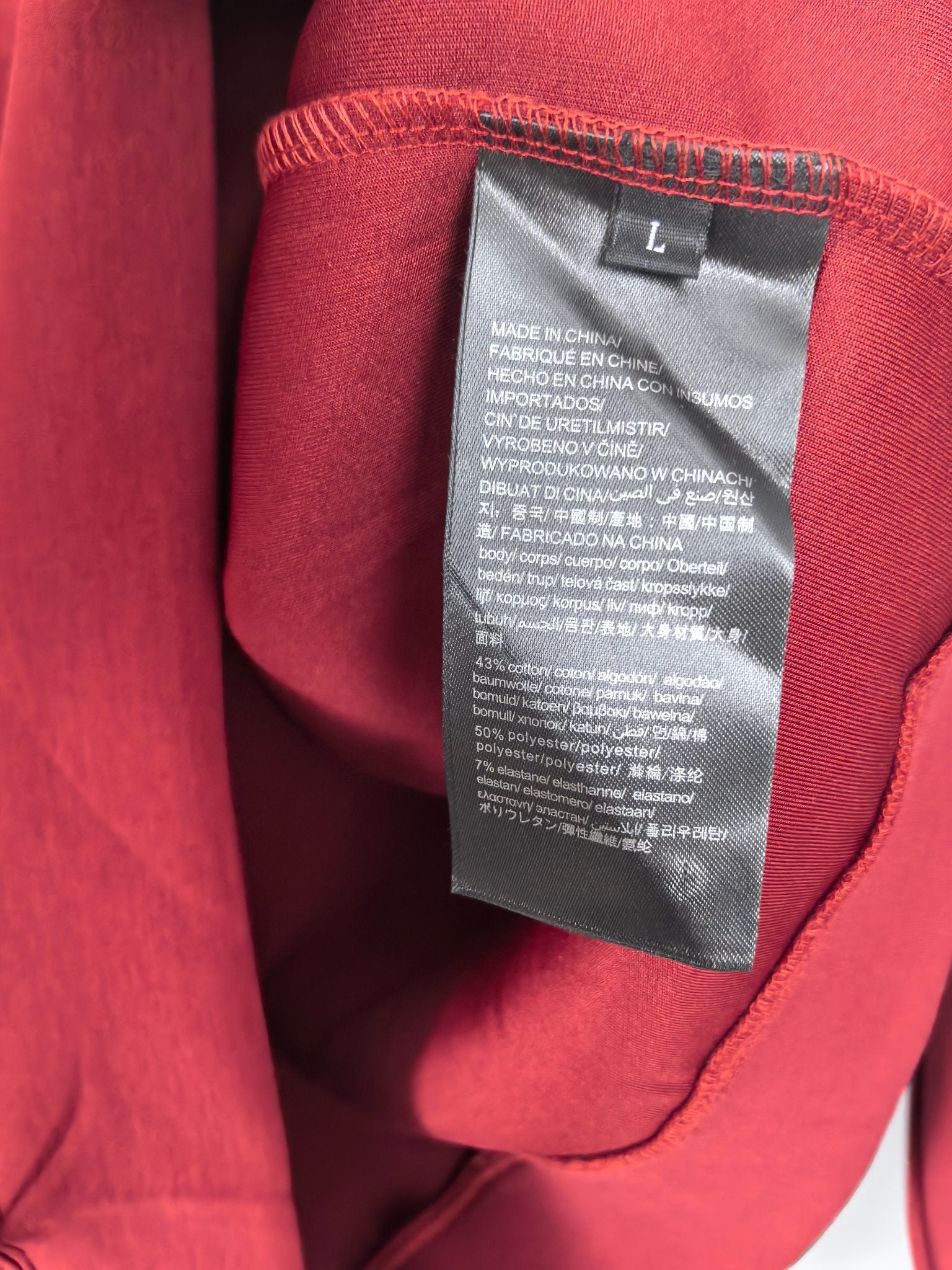 Red sweatshirt with interior size L fabric care label