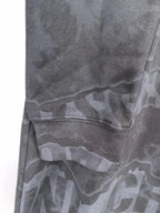 Dark gray crewneck sweatshirt side with graphic pattern and stitched seam