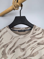 Camo crewneck sweatshirt neckline with off-white and taupe camouflage, brand label