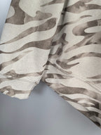 Camo crewneck sweatshirt fabric close-up, off-white and taupe