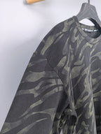 Camo crewneck sweatshirt on hanger, side view, dark gray and olive pattern