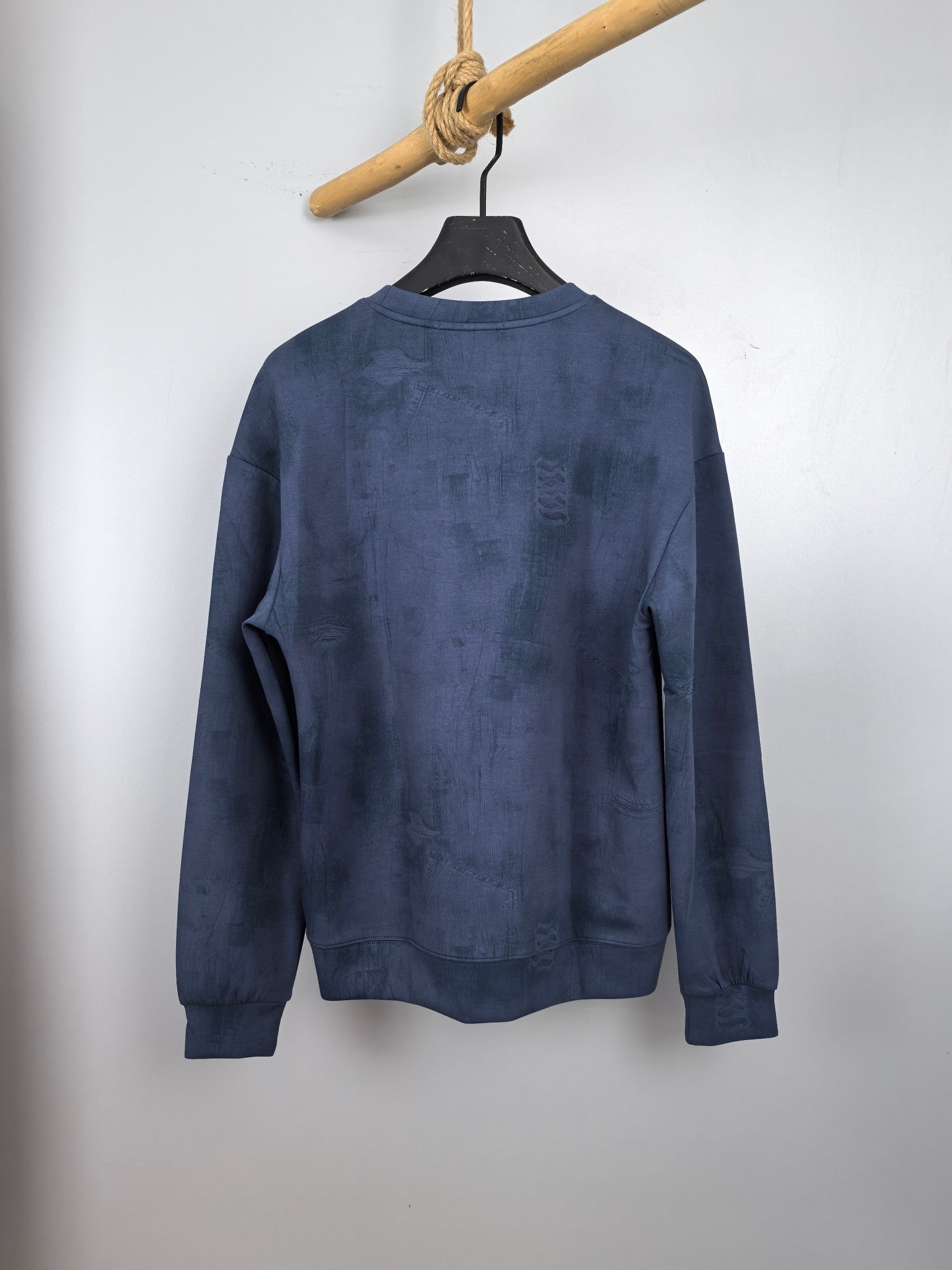 Blue Louis Vuitton long-sleeve crewneck sweatshirt, back view on hanger