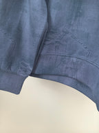 Blue Louis Vuitton long-sleeve sweatshirt hem and side seam close-up
