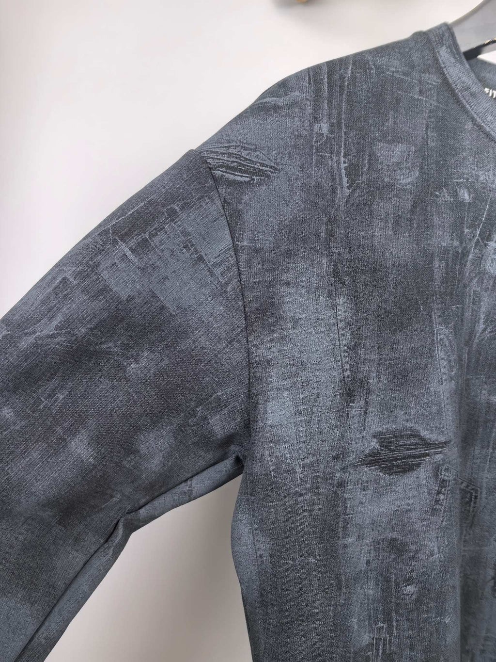 Dark navy long-sleeve sweatshirt with stitched shoulder seam and relaxed fit