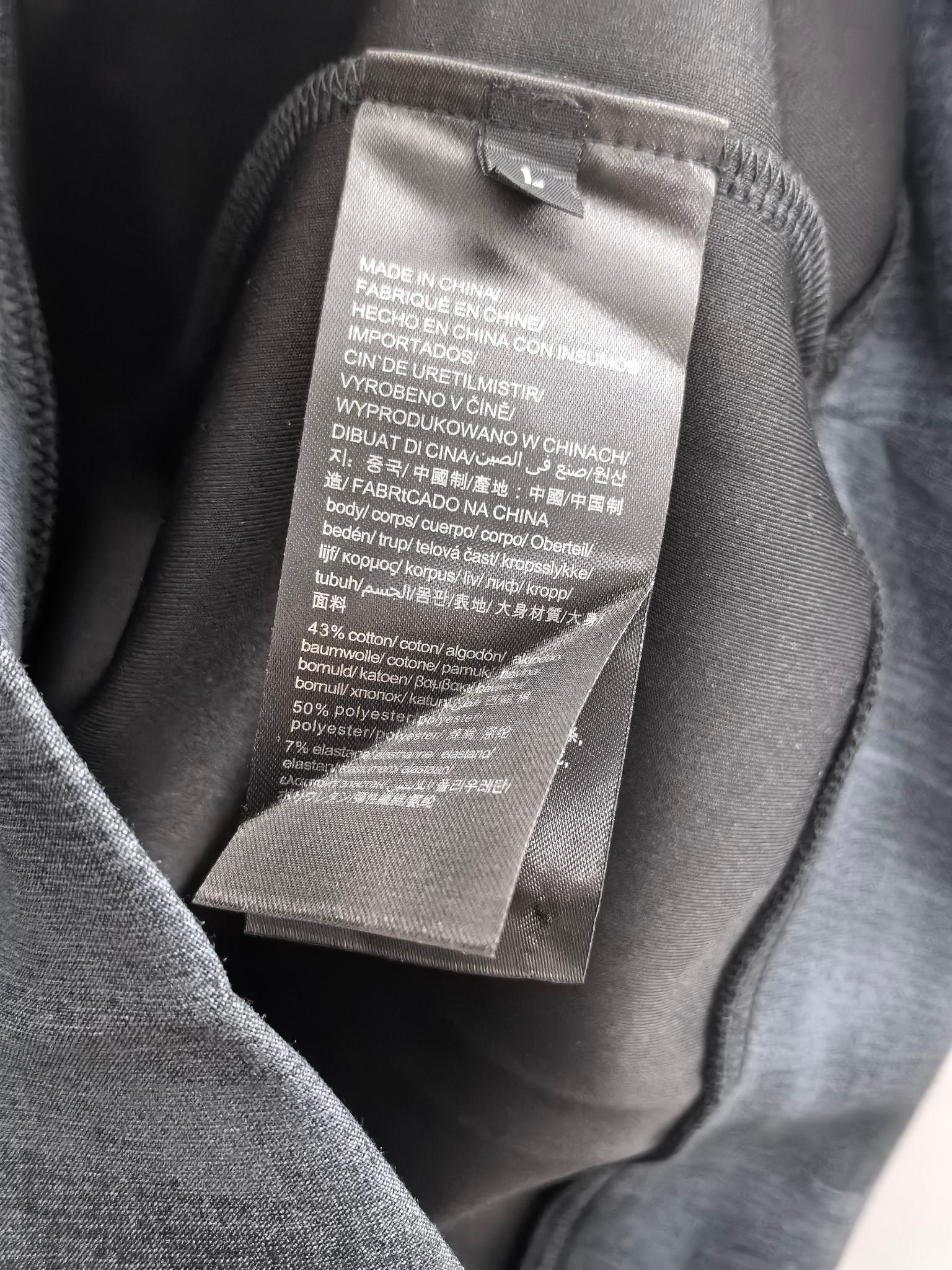 Dark navy sweatshirt with interior care label sewn in