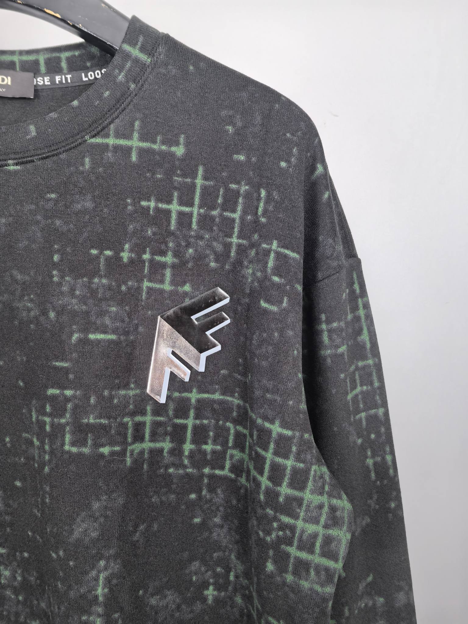 Black sweatshirt with green grid pattern and FENDI stylized logo patch