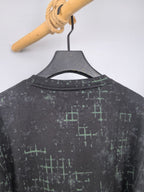 Black sweatshirt back with green grid pattern, crew neck view