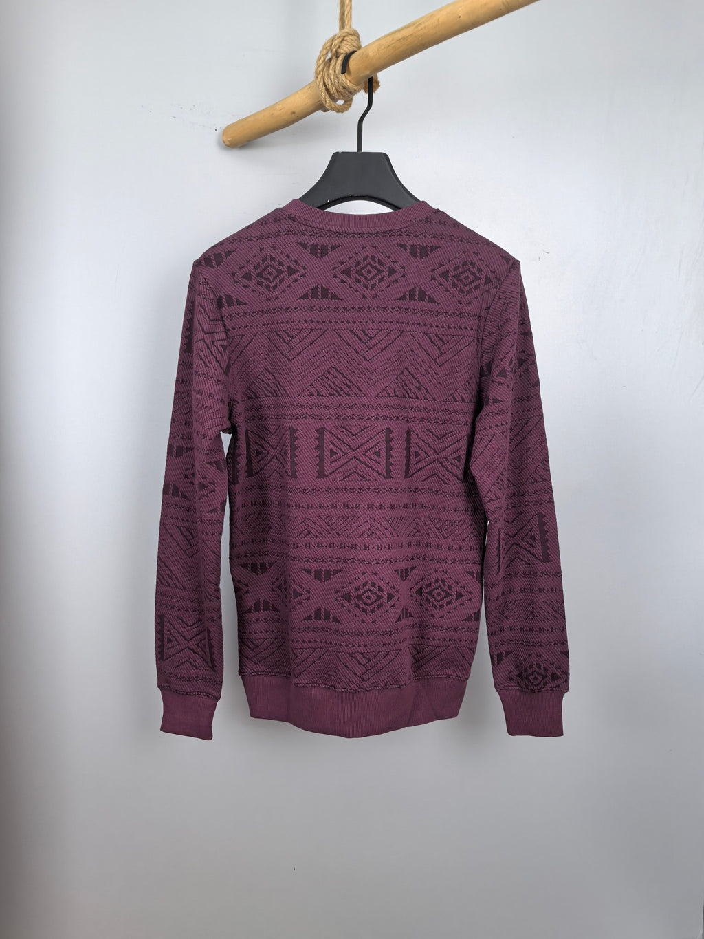 Maroon knit sweater with all-over geometric pattern, crew neck, long sleeves