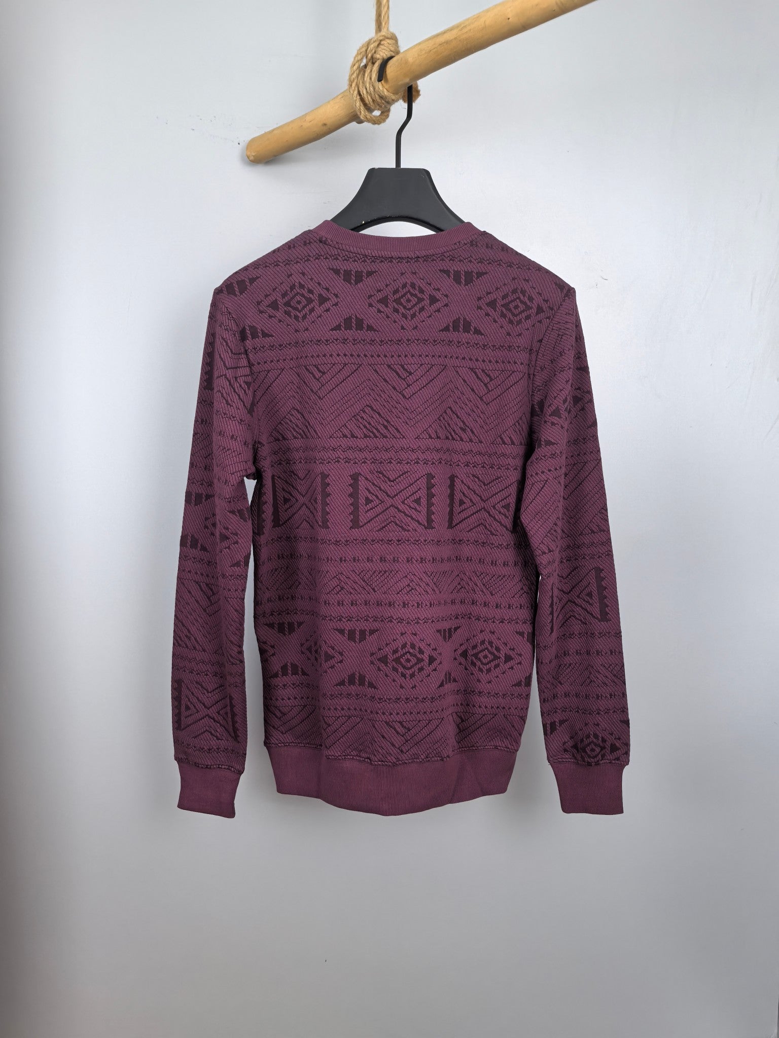Maroon knit sweater with all-over geometric pattern, crew neck, long sleeves