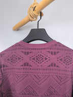 Maroon knit sweater back view with geometric pattern across shoulders and back