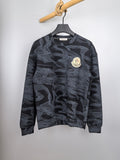 Moncler long-sleeve top, dark with light abstract pattern and round chest logo patch