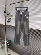 Gray denim pants with elastic waistband and white drawstring