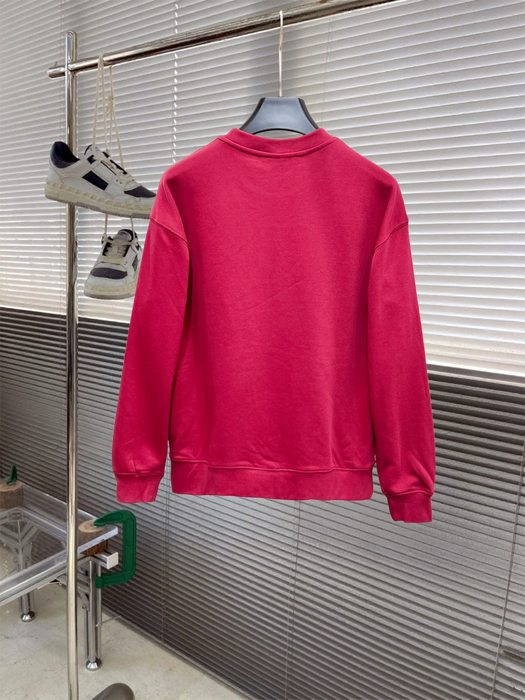 Gucci long-sleeve sweatshirt in bright pink, back view on a hanger