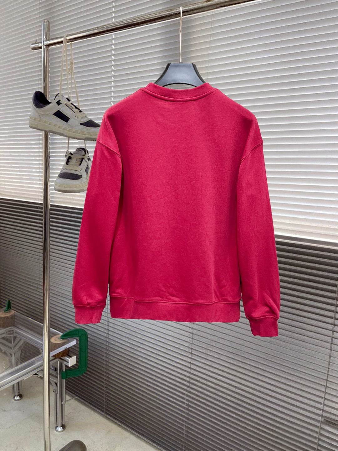 Gucci long-sleeve sweatshirt in bright pink, back view on a hanger