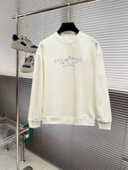 Cream long-sleeve crewneck sweatshirt with blue graphic lettering across chest.