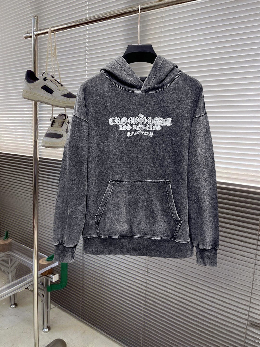 Heather gray long-sleeve hoodie sweatshirt, front view with chest graphic and pouch pocket