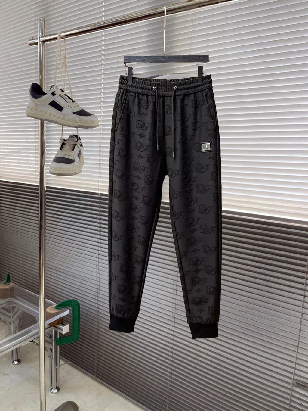 Black Dior monogram jogger pants with elastic waistband and tapered legs
