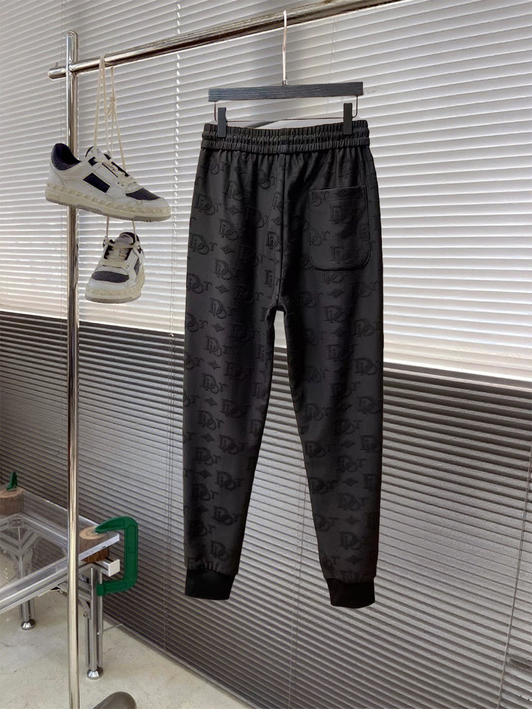Black Dior monogram tapered pants with elastic waistband and cuffed hem