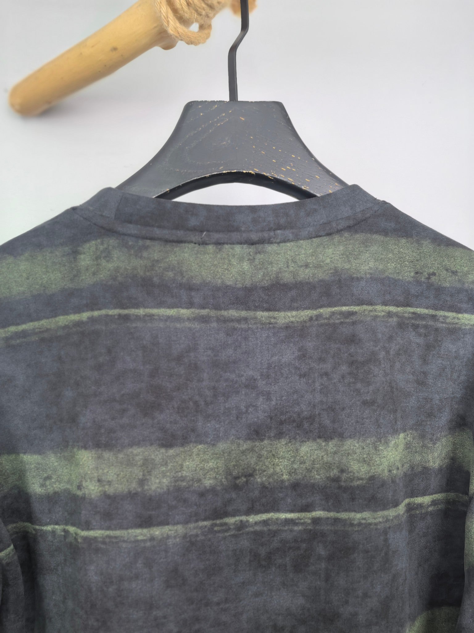Prada crewneck sweatshirt, dark gray with green horizontal stripes, upper back view.