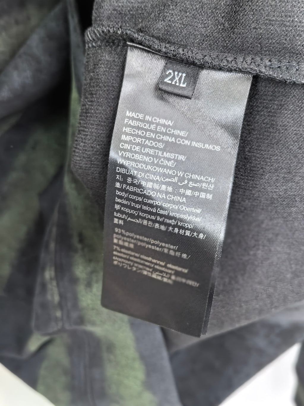 Prada sweatshirt inside size tag marked 2XL, with care and fabric info.