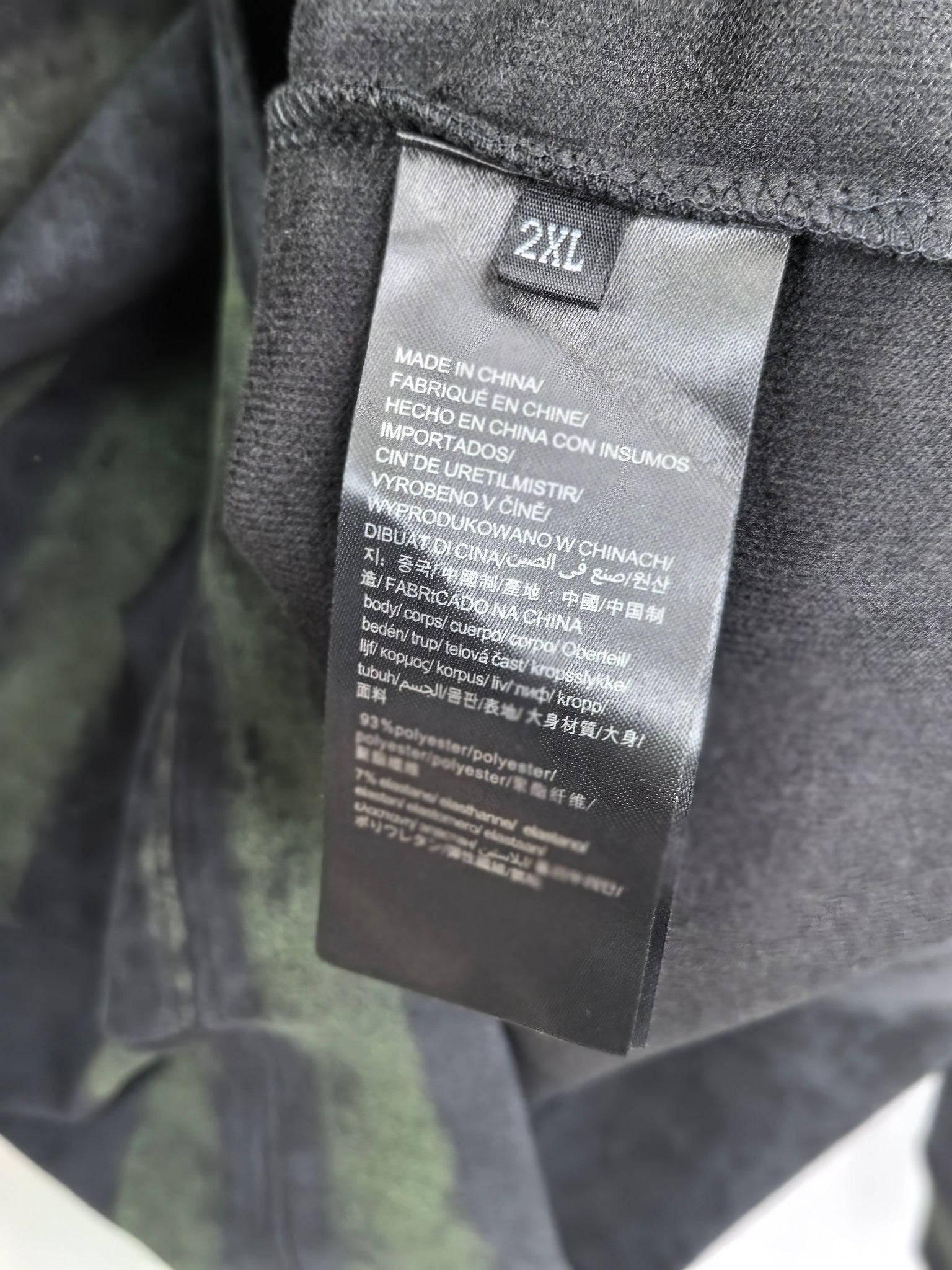 Prada sweatshirt inside size tag marked 2XL, with care and fabric info.