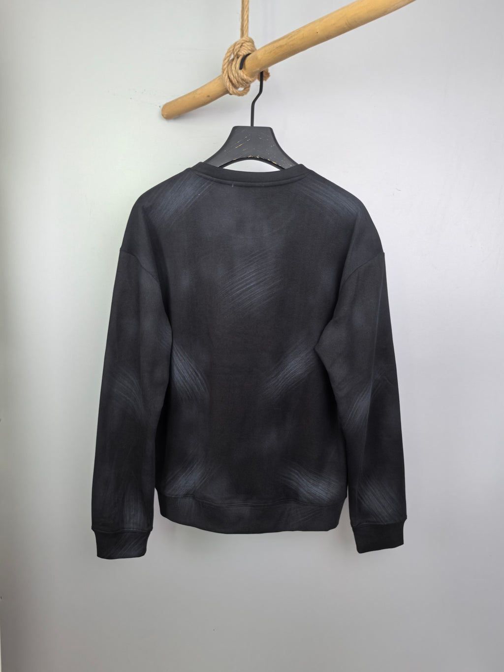 Long-sleeve crewneck shirt in dark charcoal, relaxed fit, plain back view