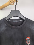 Long-sleeve crewneck shirt neckline and chest patch graphic, dark charcoal knit