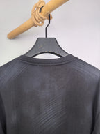Long-sleeve crewneck shirt back view, dark charcoal with neckline collar