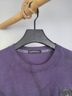 Purple crewneck sweatshirt neckline and collar label detail on hanger