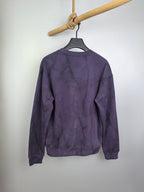 Purple long-sleeve crewneck sweatshirt with textured print, hanging on hanger