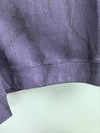 Purple sweatshirt back panel with ribbed hem and faint fabric texture