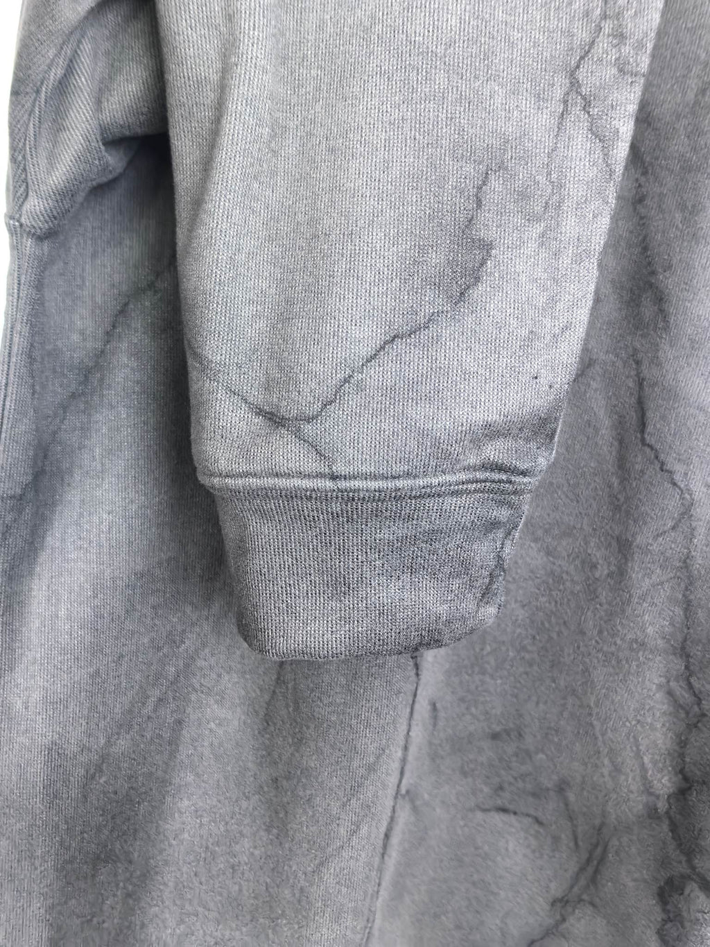 Dark gray marble print sweatshirt with ribbed cuff and hem detail