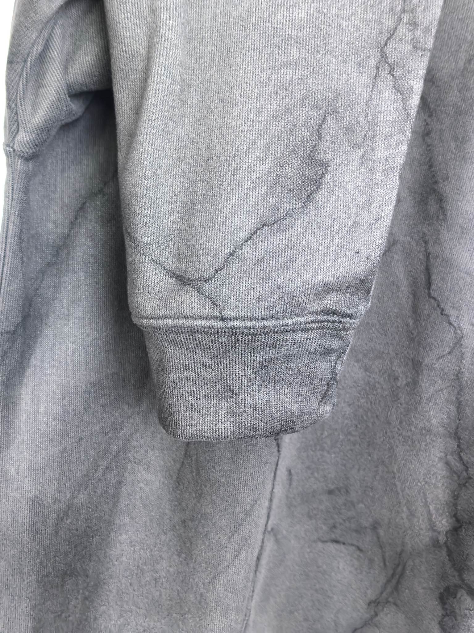Dark gray marble print sweatshirt with ribbed cuff and hem detail