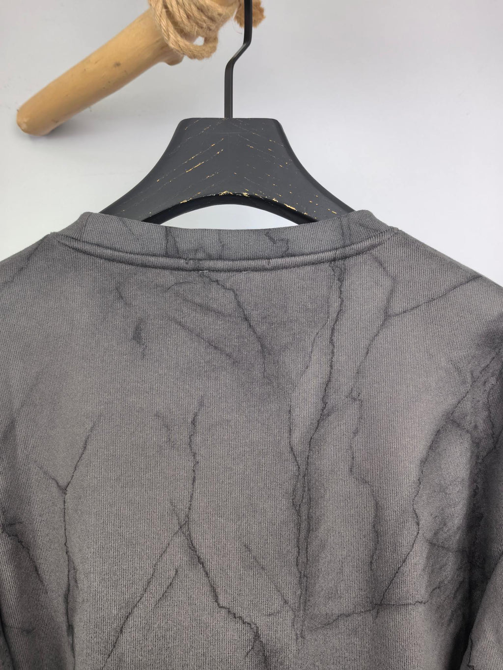 Dark gray marble print long-sleeve sweatshirt with crew neckline, back view