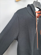 Dark gray hoodie with front zipper and orange drawstring ties at collar