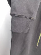 Dark gray zip-up hoodie with ribbed cuffs and hem, plus neon green drawstring