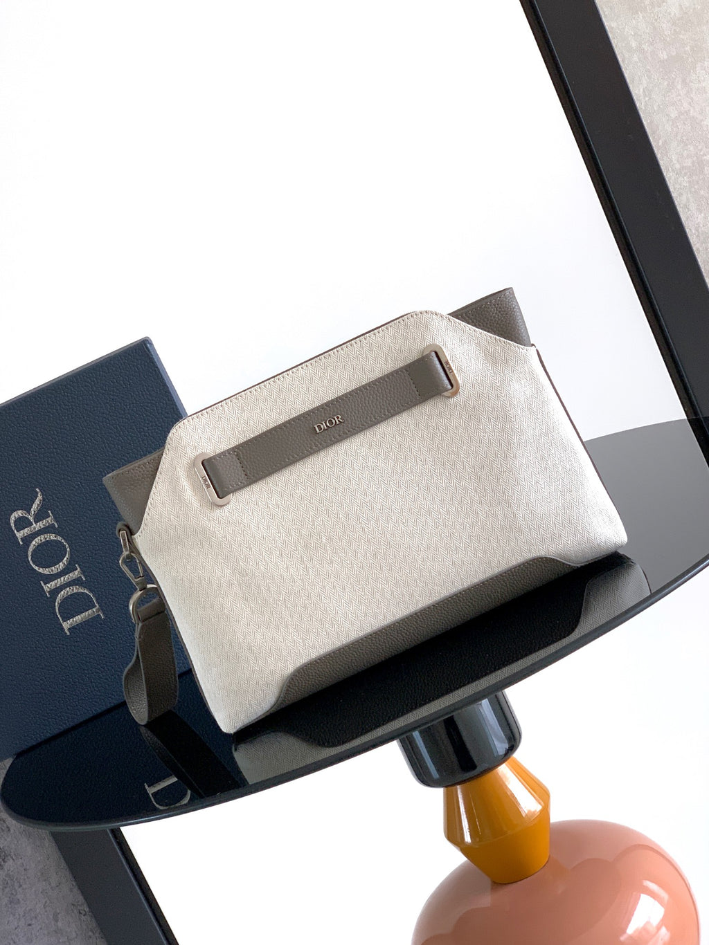 Dior men’s small zip pouch bag in light beige canvas with top handle tab