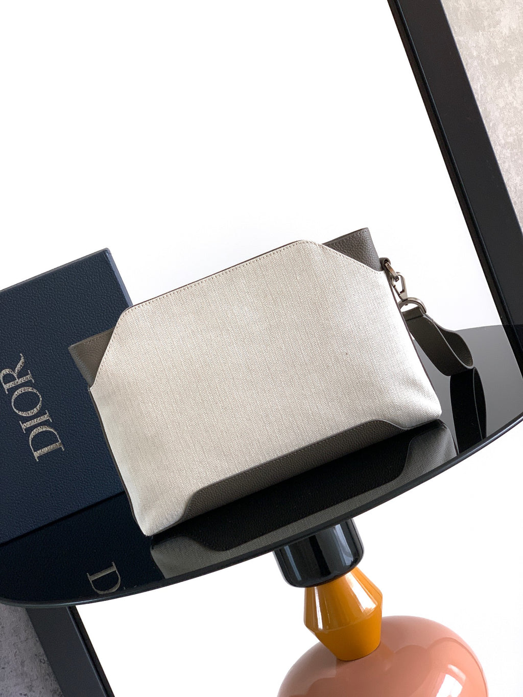 Dior men’s small zip pouch bag in light beige canvas with front handle and flap