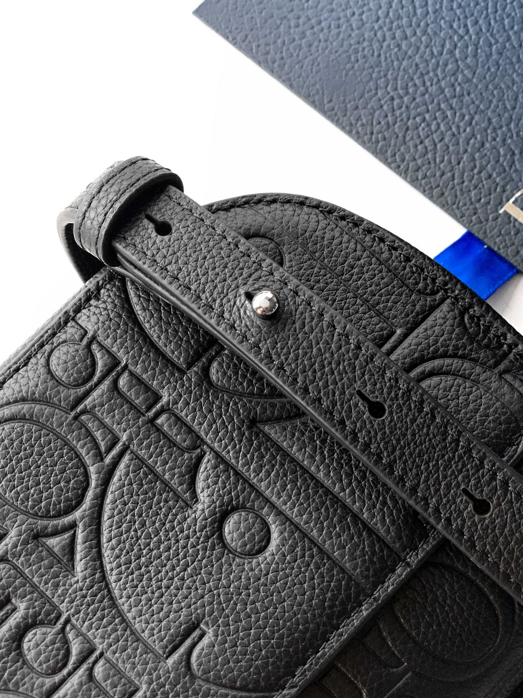 Dior men's black leather belt bag with embossed pattern and strap