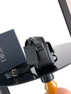 Dior leather crossbody bag with adjustable strap and front flap