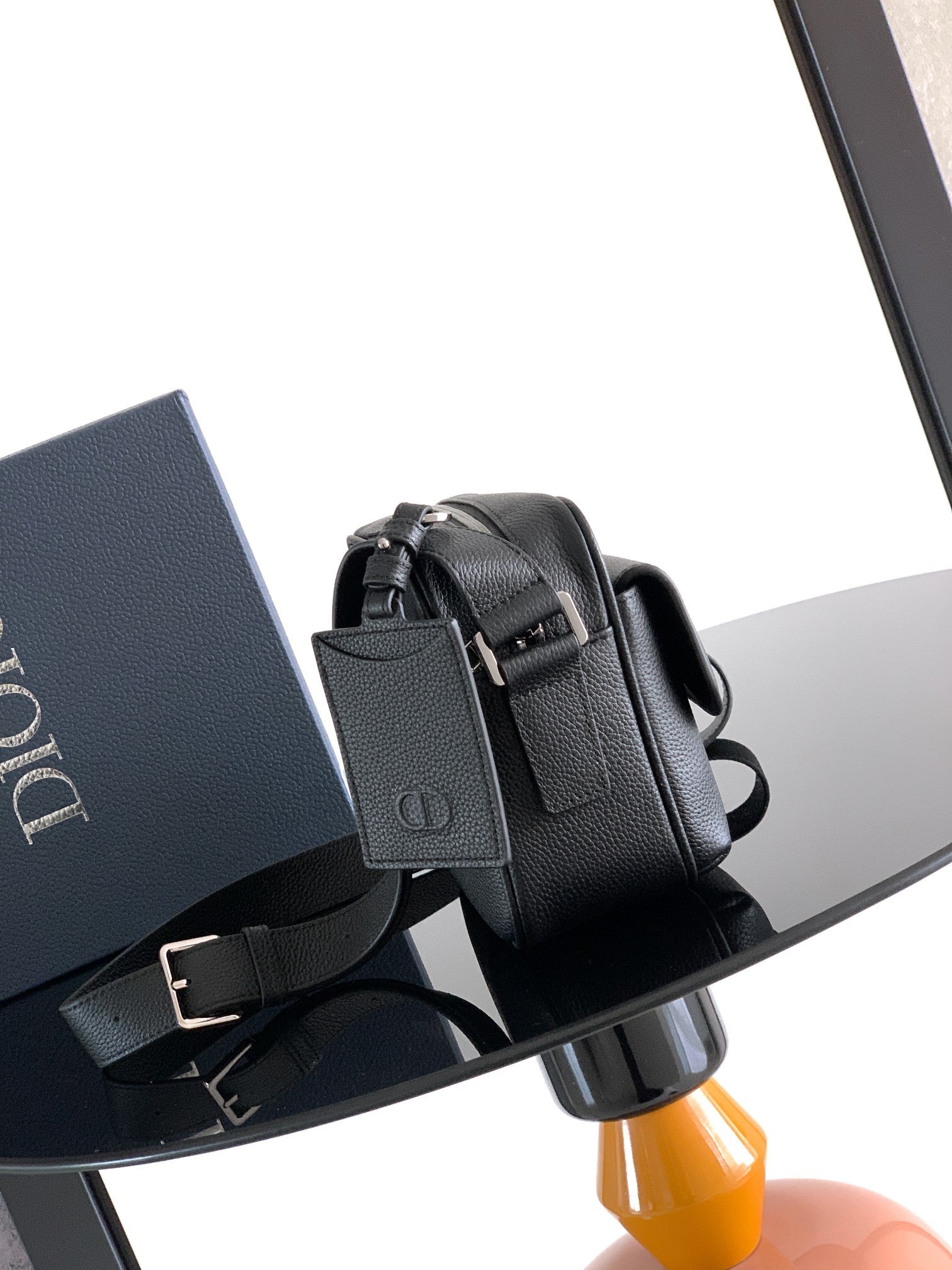Dior leather crossbody bag with adjustable strap and front flap