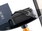Dior leather bag with front flap and D-ring strap buckle