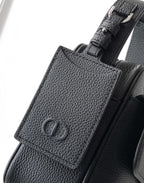 Men's Dior bag with front leather patch and textured black grain