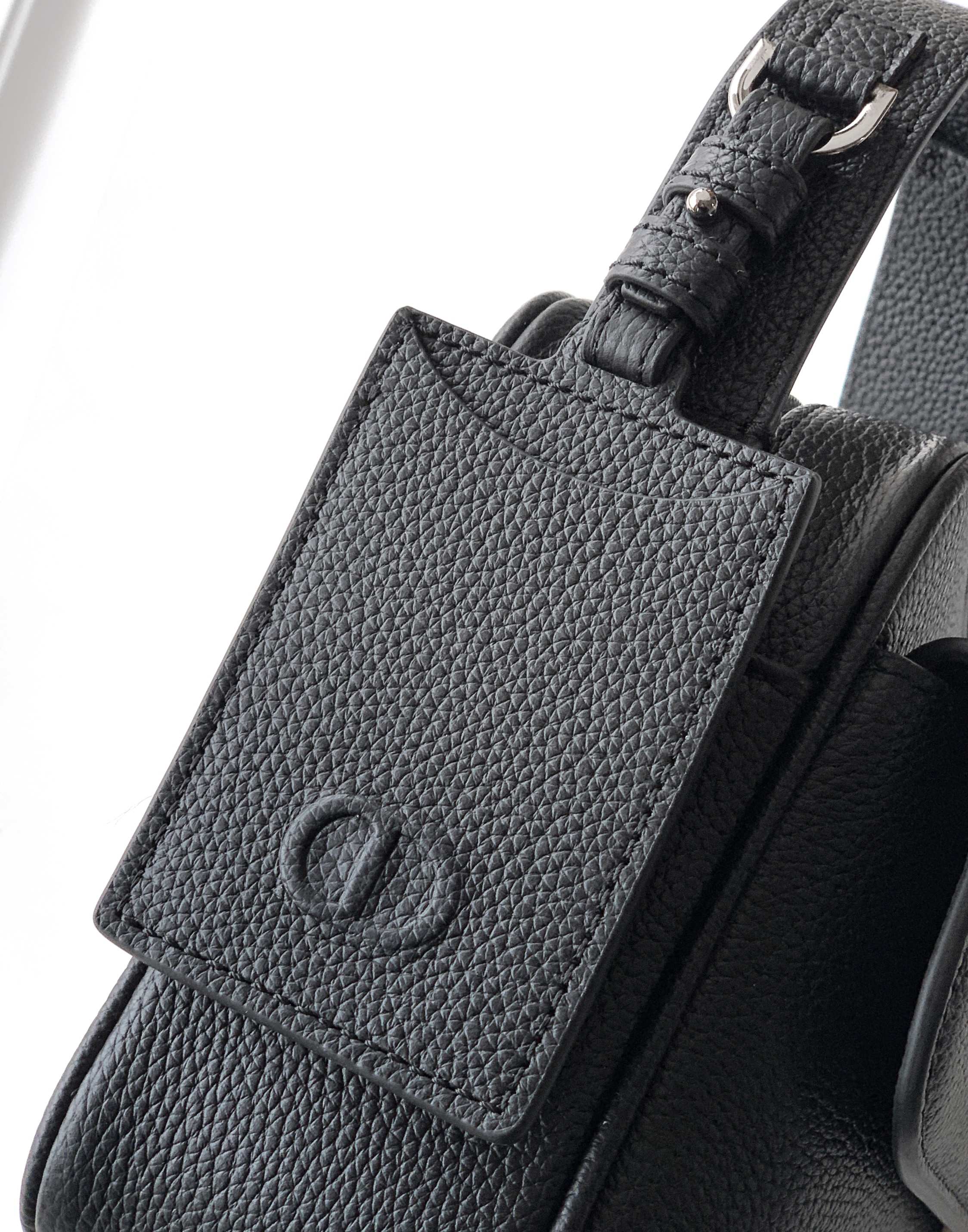 Men's Dior bag with front leather patch and textured black grain