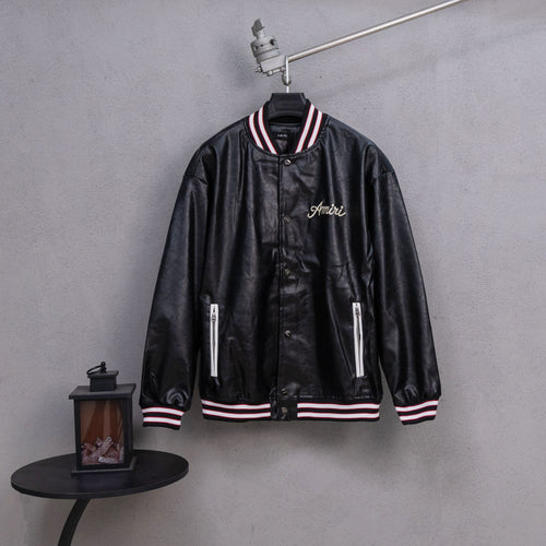 Amiri black leather bomber jacket with varsity striped collar and front zip closure